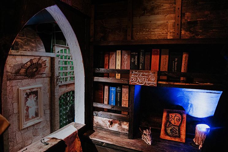 A shelf of books from the Wizards Library in our magical escape room!